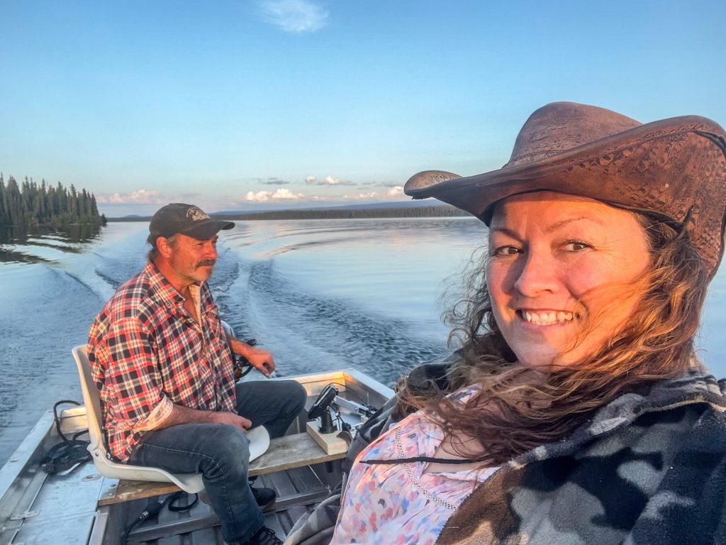 Jennifer and Arön Toland boat ride at sunset - enjoying life at their fishing resort at Eliguk Lake Lodge.